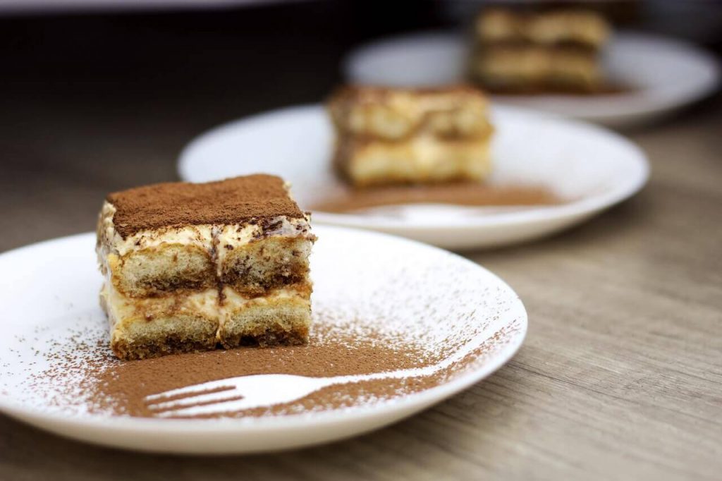 An image capturing the exquisite beauty of a classic dessert, Tiramisu.